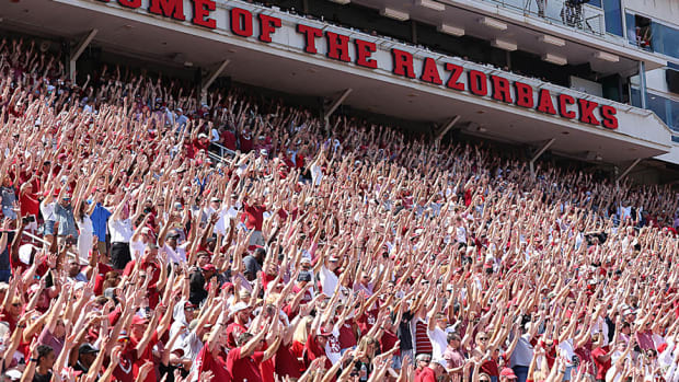 Arkansas fans finish up a Hog call for the Arkansas game against Cincinnati last season.
